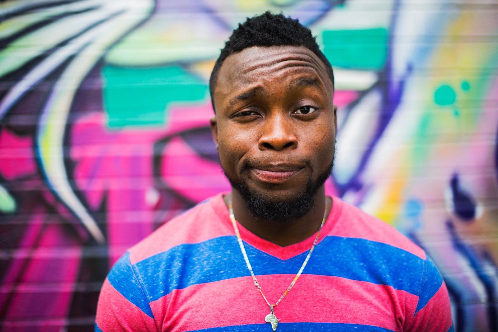 black haired man making facial expressions